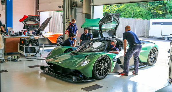 An Aston Martin Valkyrie in a workshop being worked on